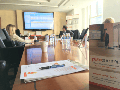 Conference room with participants attending PIRO Summit jewelry software event